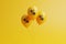 Set of yellow balloons with black percent sign floating on yellow background