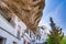 Setenil de las Bodegas, Spain - April 6, 2023: Typical Andalucian village with white houses and sreets with dwellings built into