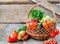 Sets with organic vegetables on a wooden background.