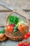 Sets with organic vegetables on a wooden background.