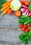Sets with organic vegetables on a wooden background.Copy space b
