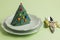 Setting elegance Christmas service with green color,special folded pine tree shaped,paper napkin in plate with cutlery set