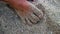 setting footprints on beach sand, painting feet on beach sand in a beautiful morning