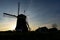 The setting sun behind the windmill Tweemanspolder Nr. 4 near the Rottemeren, Zevenhuizen, The Netherlands