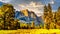 Setting Sun casting glowing sunlight over the almost dry Yosemite Upper Falls at Yosemite Point