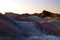 Setting Sun on the colourful eroded mountains ridges, ancient rock formations of the hottest place on earth, Death Valley