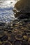 Setting sun highlighting the hexagonal Basalt slabs of Giants Causeway