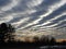 Setting sun highlights giant storm clouds arriving