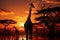 Setting sun illuminates a transformed landscape with a giraffe herd