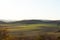 Setting sun on the left side and view of the countryside and surrounding nature panoramic view of the surrounding hills and