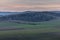 Setting sun on the left side and view of the countryside and surrounding nature panoramic view of the surrounding hills and