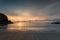 Setting Sun on serene tranquil shoreline, Porthcothan Beach, Cor