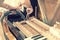 Setting up an old piano. The master repairs an old piano. Deep cleaning the piano. Hands of professional worker repairing and