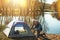 Setting up their shelter. a senior couple setting up a tent while camping in the wilderness.