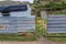 Settlement behind a metal sheet fence in the Karakol valley in Kyrgyzst