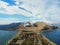 Sevan Lake and Sevanavank oldest church. Mountains country Armenia. Aerial view from above by drone