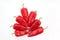 Seven bright red sweet peppers on a white background