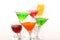 Seven cocktail and wine glasses with color drinks in the chaoti