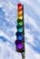 Seven-color traffic light above blue sky