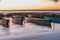 Seven fishing boats at sunset