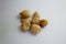 Seven group of Candlenut Aleurites moluccanus : kemiri, indian walnut is a dry herbs, traditional cooking ingredients close up