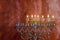 Seven Hanukkah candles are burning on light of jewish holiday sixth day of the Jewish holiday Hanukkah