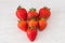 Seven in a heart Shape  Healthy Scottish Strawberries on a White Plank Board