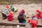 Seven little kids playing in sandbox cloudy autumn day