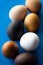 Seven multi-colored eggs lie on the table