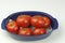 Seven Red Tomatoes in a Blue Bowl