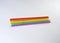Seven straws of rainbow colors lie on a light gray background. Bright colors. The colors symbolize the concept of