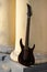 Seven-string electric guitar made of dark wood. Background for music and creativity