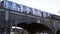 Seven Train on elevated train tracks in New York City, empty street below subway