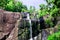 Seven Wells Waterfall in rocky mountains and jungle on tropical island