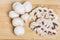 Seven white button mushrooms and slices