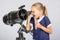 Seven-year girl with interest and mouth open looking into the reflector telescope and looks at the sky