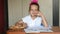 Seven-year girl schoolgirl doing snacking biscuits