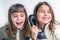 Seven year old girl talking on the old vintage phone and her sis