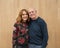 Seventy-three year-old father in an affectionate pose with his forty-eight year-old daughter after a dance performance.