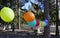 several balloons on a string at outdoor children\\\'s party
