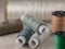 Several bobbins of spools of thread are on a gray background