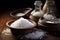 Several bowls of different types of salt on a wooden table