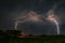 Several branched lightning strokes strike down to earth during a severe thunderstorm in Romania