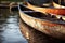 several canoes float on water