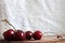 A several cherries are on the cutting board with white background