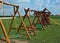 Several children hammocks in a row on a playground