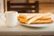 Several churros on small plate and milk with chocolate