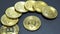 Several coins of gold bitcoins on a dark background