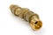 Several connected brass plumbing components at selective focus