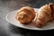 Several croissants on a plate close up